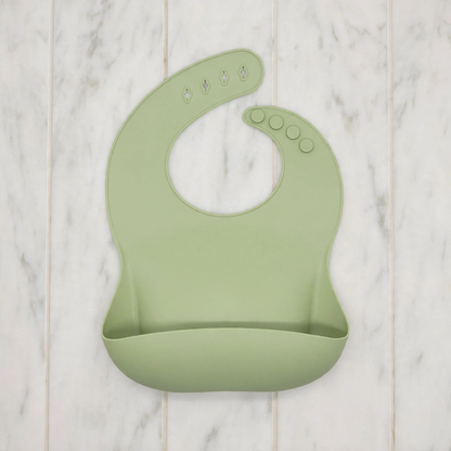 Babero de silicona con bolsillo recogemigas impermeable